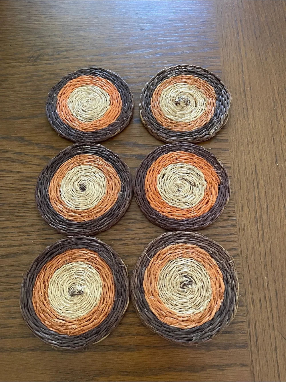 Vintage Round Woven Coasters in Brown, Orange, and Natural